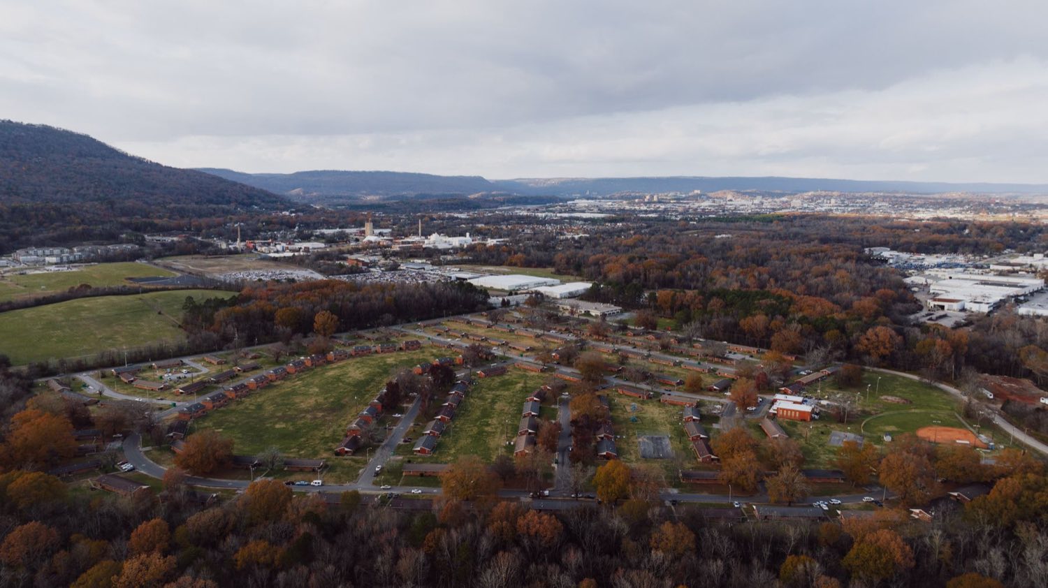 Aerial view of Chattanooga neighborhoods with wooded ridges behind
